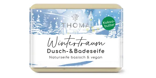 rechteckige, beige Seife mit blauer winterlicher Verpackung und Aufschrift Wintertraum, Kakaobutterseife als Dusch-und Badeseife von der Naturseifen Manufaktur Uckermark.